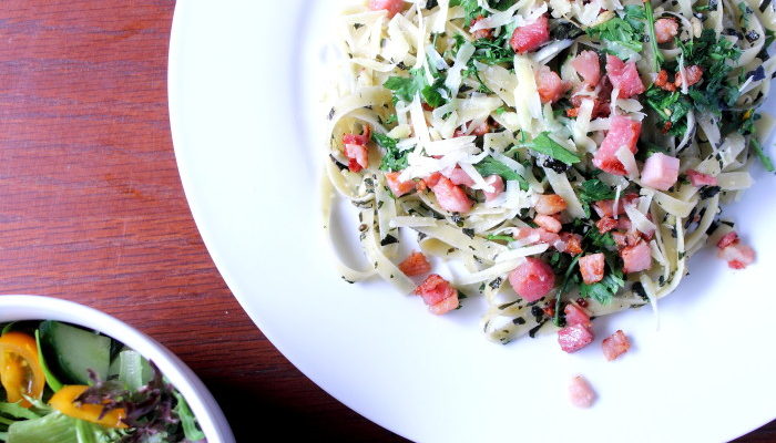 Fettuccine pesto with bacon, parsley and parmesan cheese